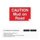 Construction site warning sign: "Caution - Mud on road"