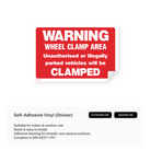 A rectangular sign warning of wheel clamping in the area.