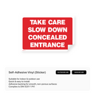 A triangular sign with the text "TAKE CARE - SLOW DOWN - CONCEALED ENTRANCE".