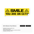 Sign with a smiley face and text "You're on CCTV."